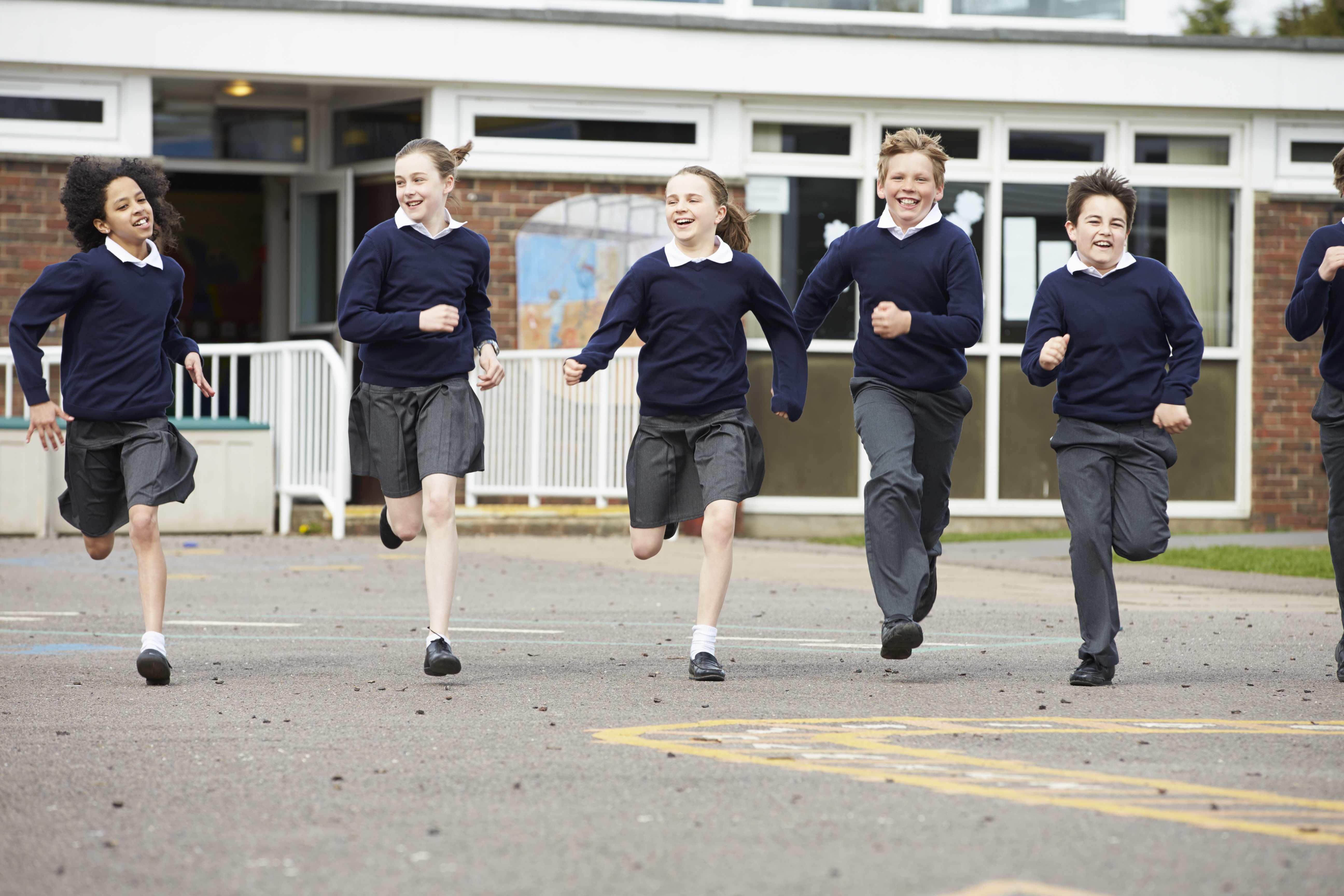 Pupils Running In Playground